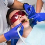 Does Medi-Cal cover root canals in Vista, CA, patient reviewing benefits at Alta Vista Dental